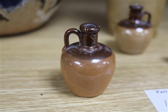 A pair of Doulton Lambeth stoneware jardinieres, three jugs and a tyg